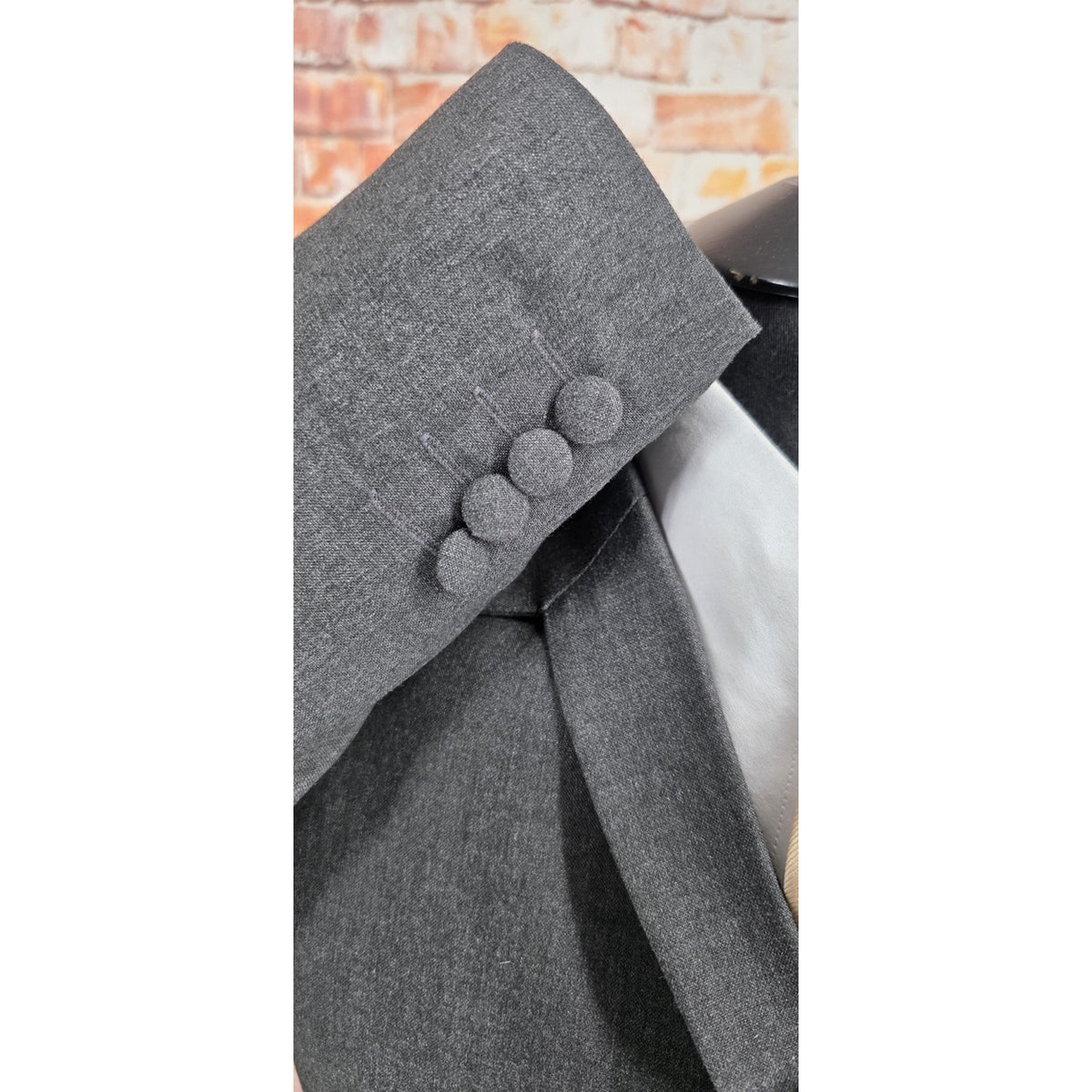 Jerry grey wool blend jacket with four cloth-covered cuff buttons