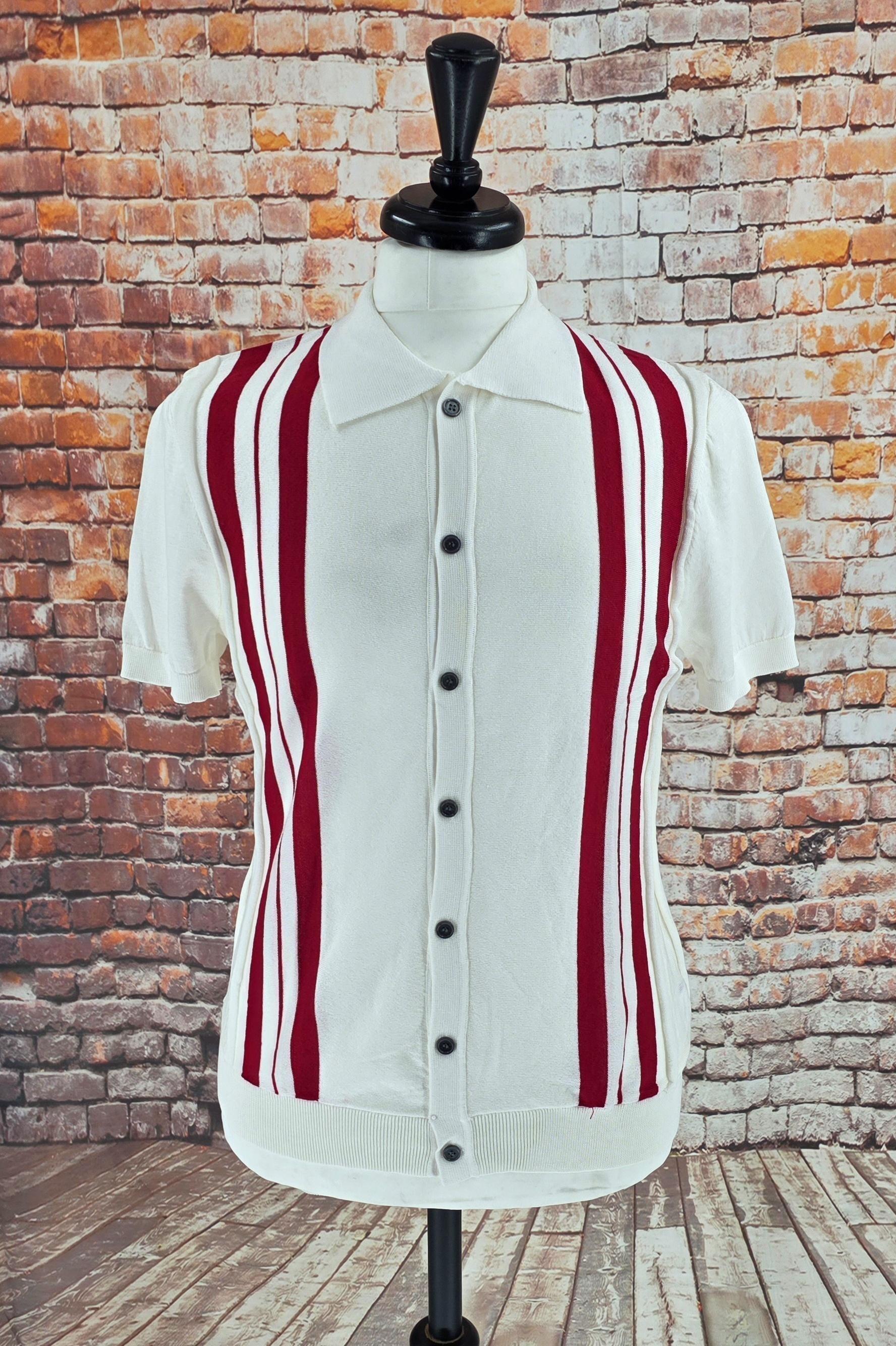 Front view of a white retro knit shirt with red vertical side stripes and dark buttons.
