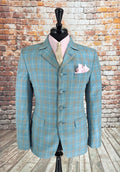 The Ashworth suit jacket front with pink shirt and gold tie styling