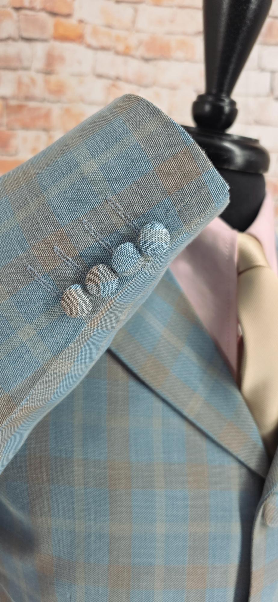 The Ashworth sleeve cuff with four fabric‑covered buttons