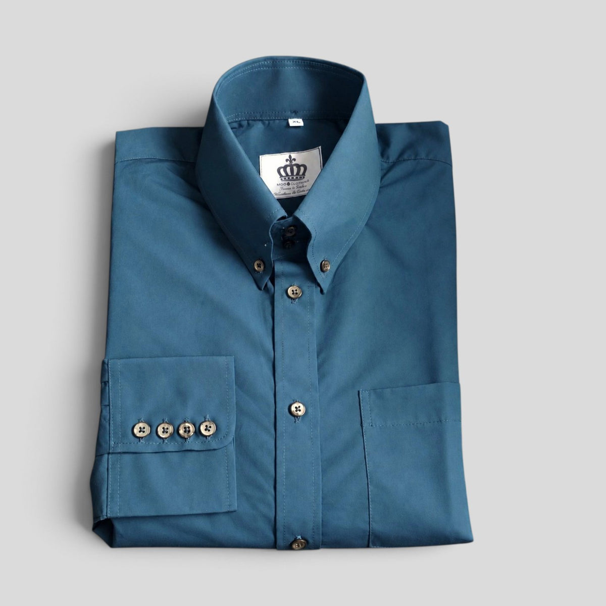 Sterling teal blue high four-button button-down collar shirt — folded front view