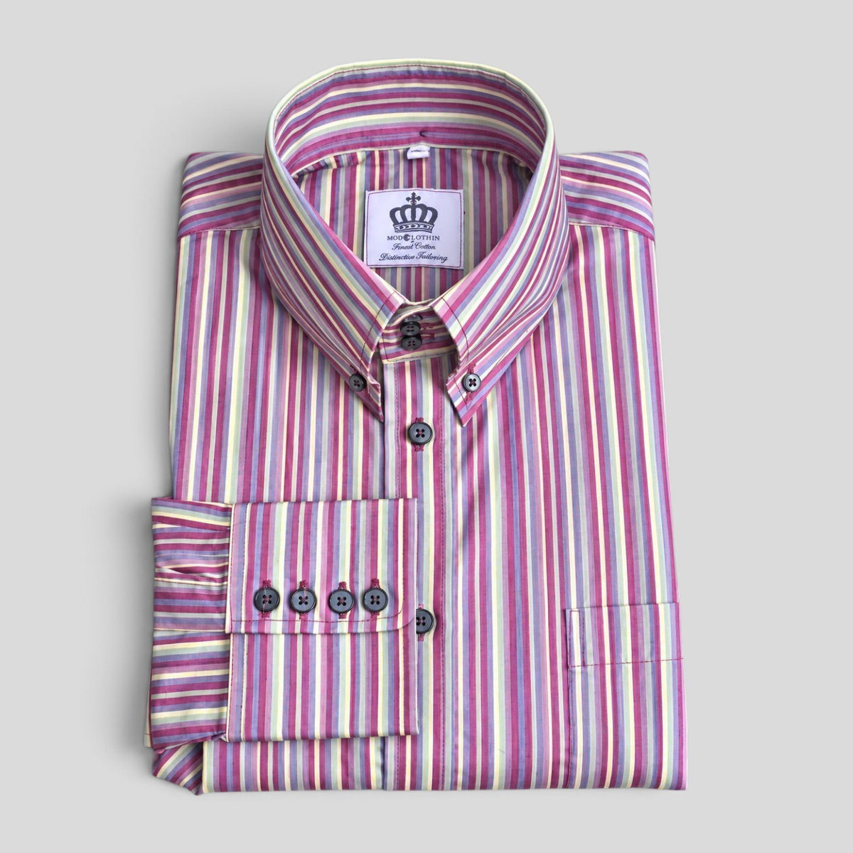 Milo pink, purple and mint multi-stripe shirt folded full front view with Modclothin label visible