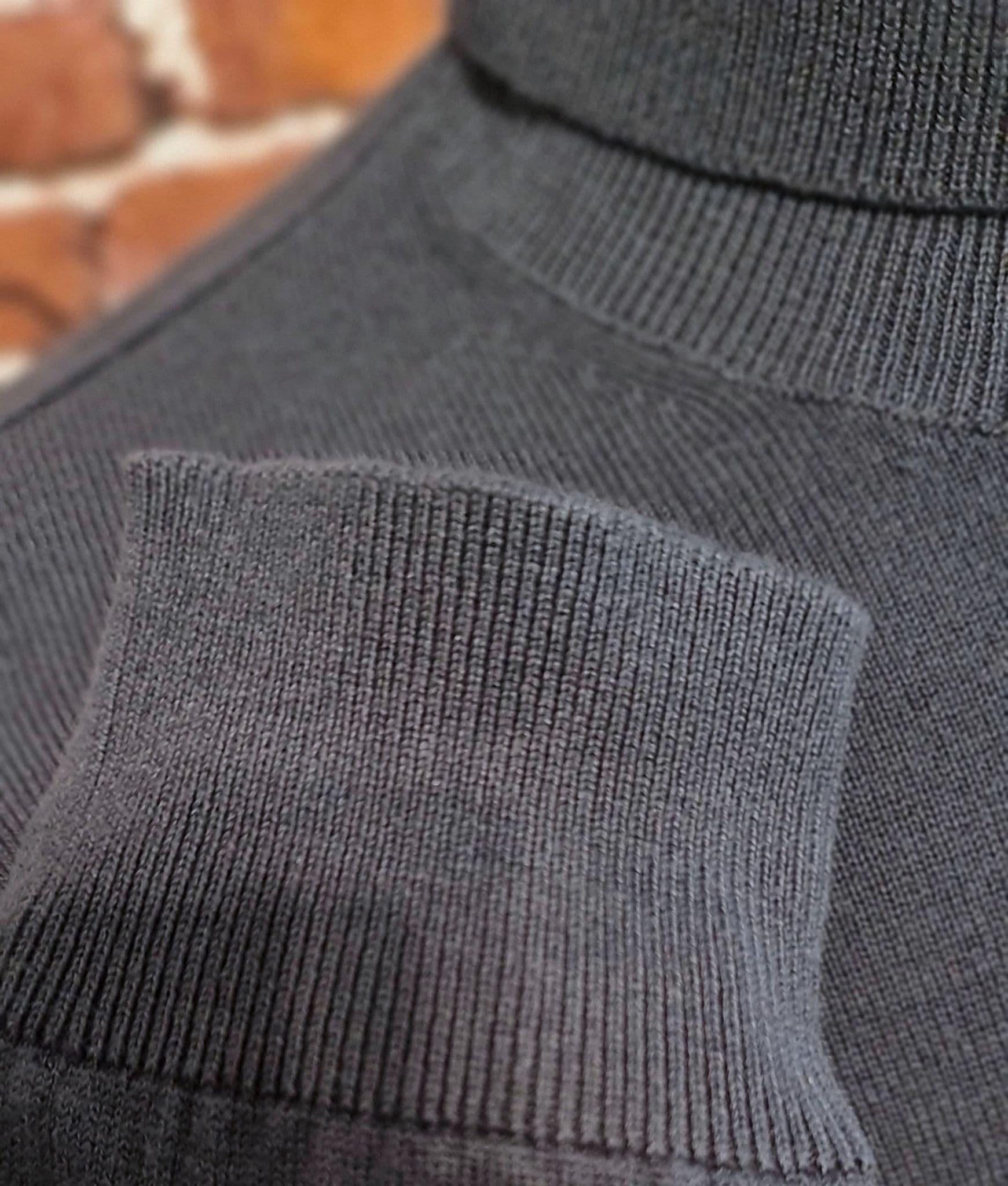 Slate Long Sleeved Roll Neck Jumper.